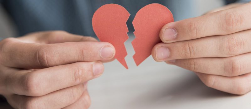 close-up-hands-holding-broken-heart